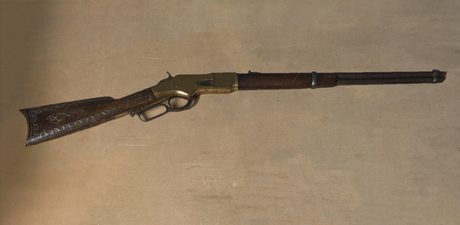 Winchester 1866 rifle. Has engraved decoration of anthemia on the wooden stock.