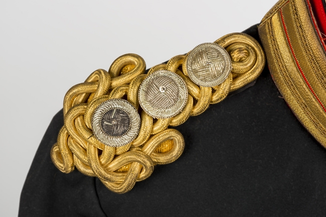 Gold-braided epaulettes of the same uniform